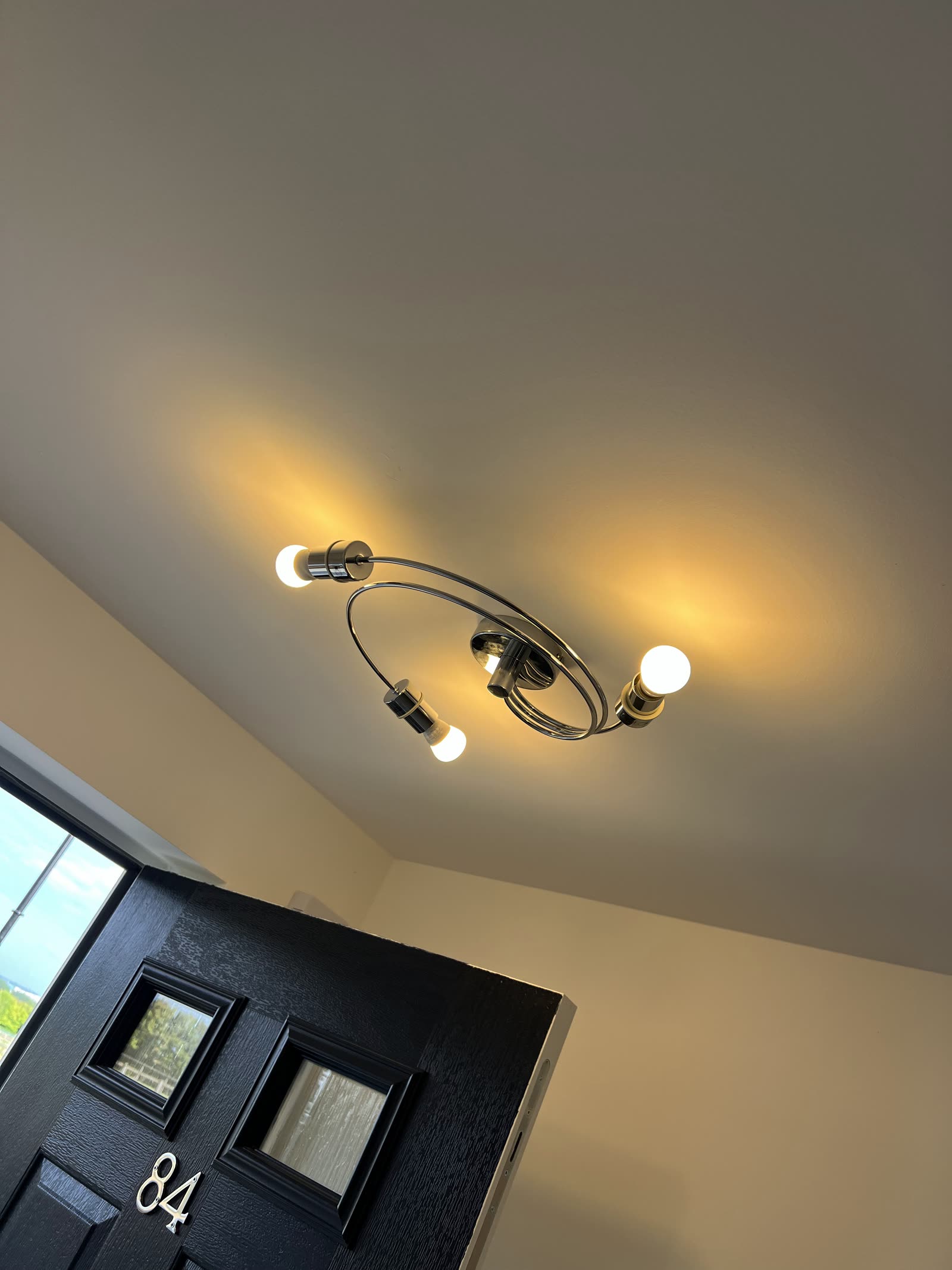 Warm cove lighting picking out a curved ceiling detail.